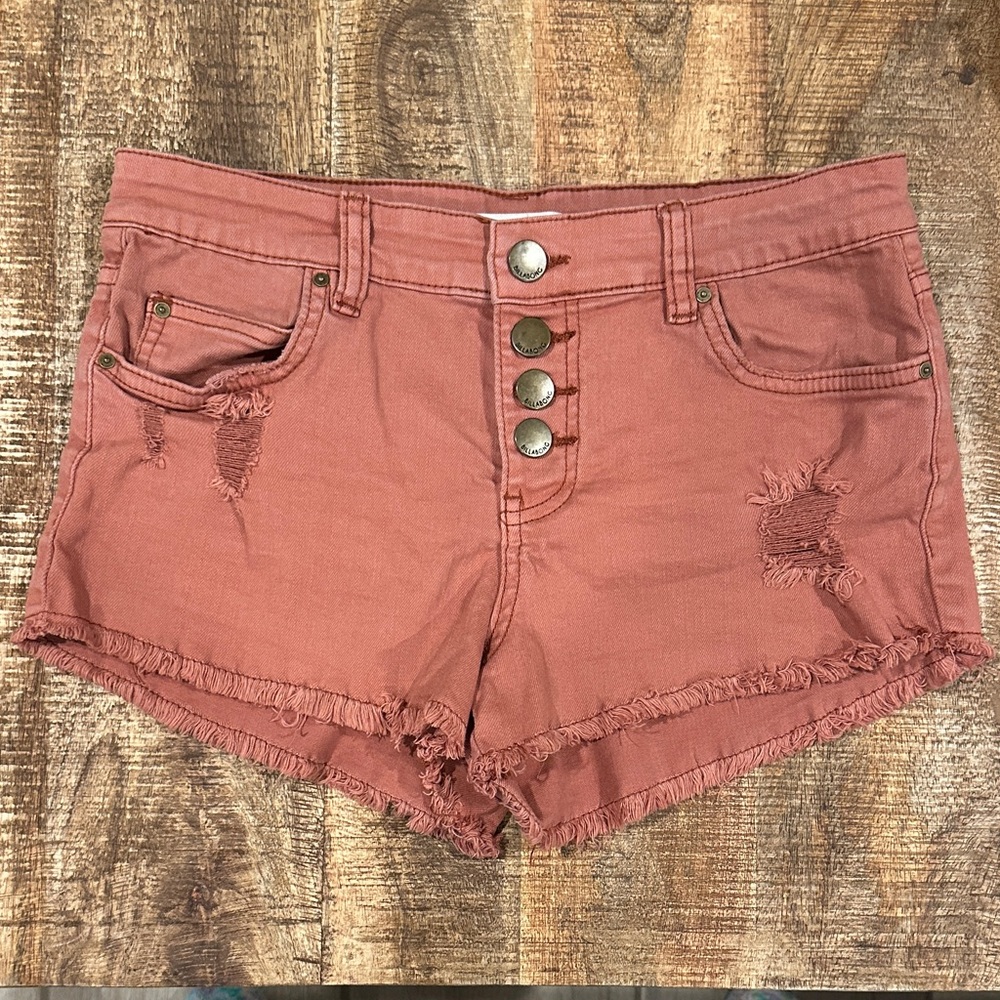Billabong Junior’s Distressed Cut-Off Button-Fly Shorts in Pink